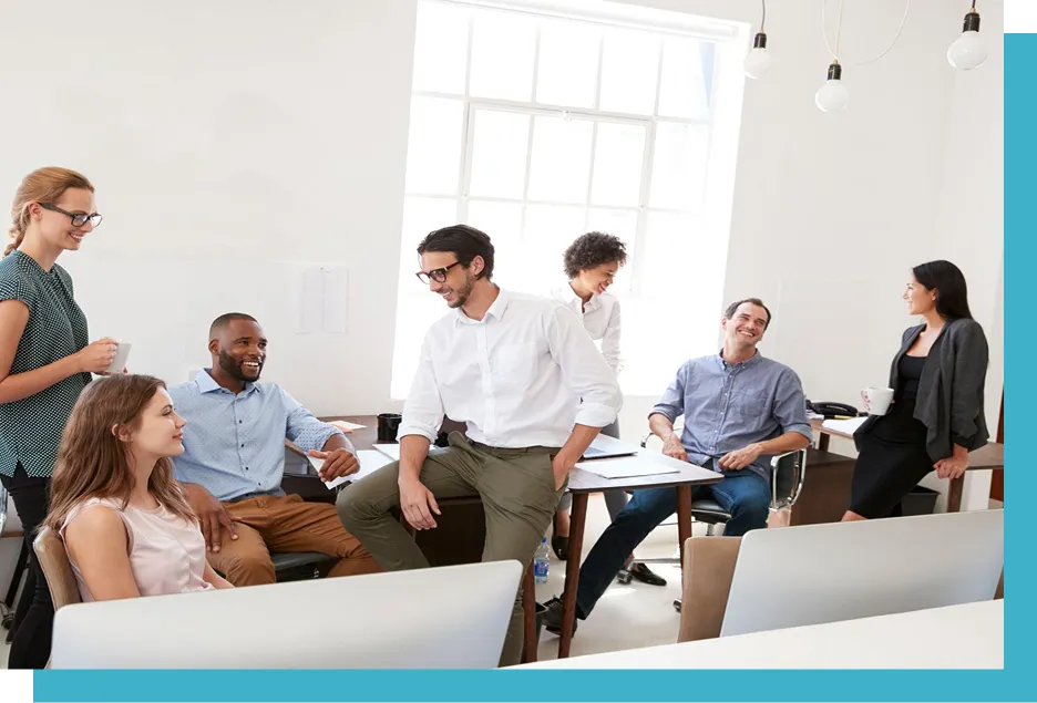 group of people hanging out and talking in an office