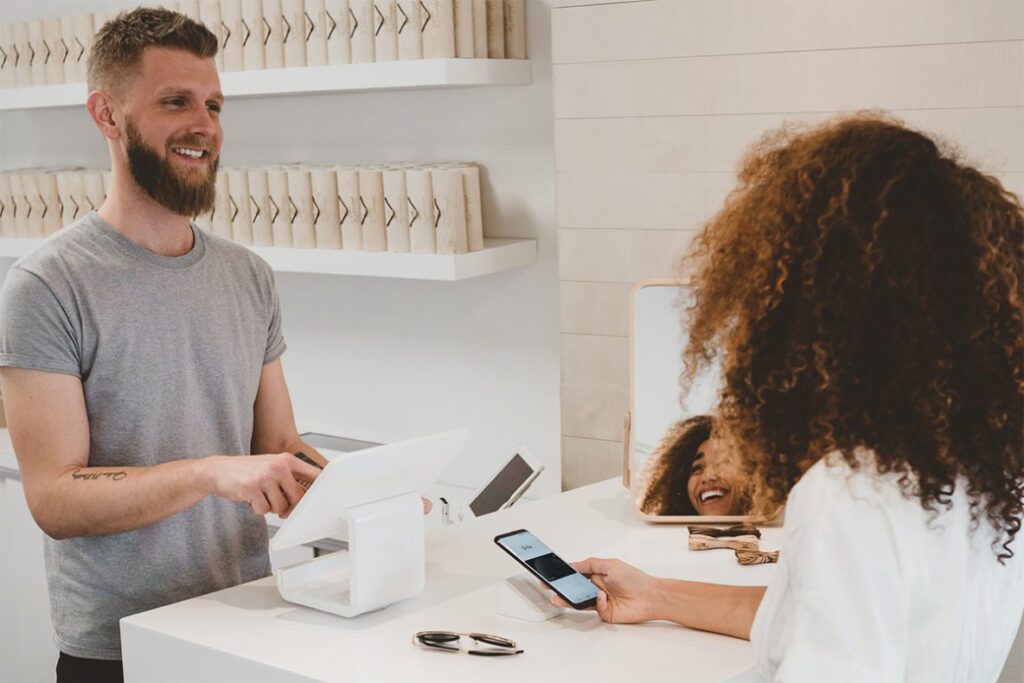 woman checking out at store