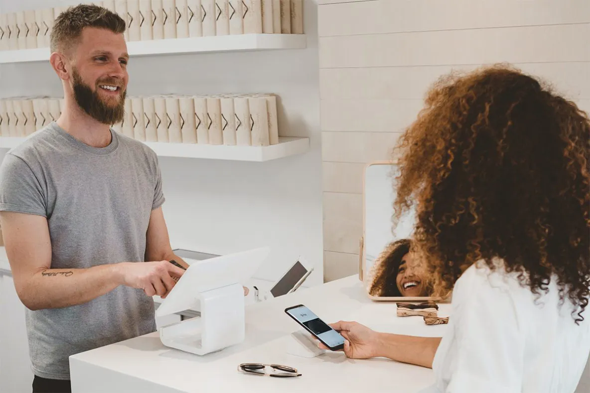 woman checking out at store