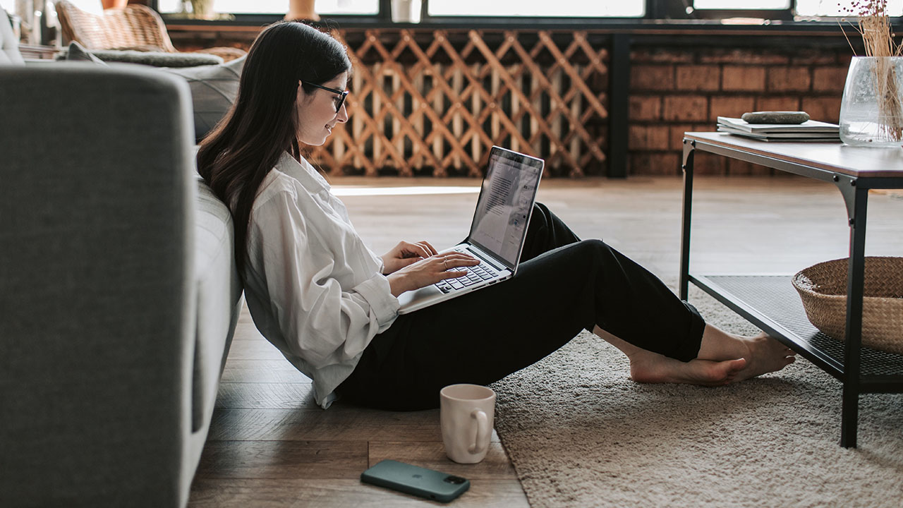 Woman working on the floor at home