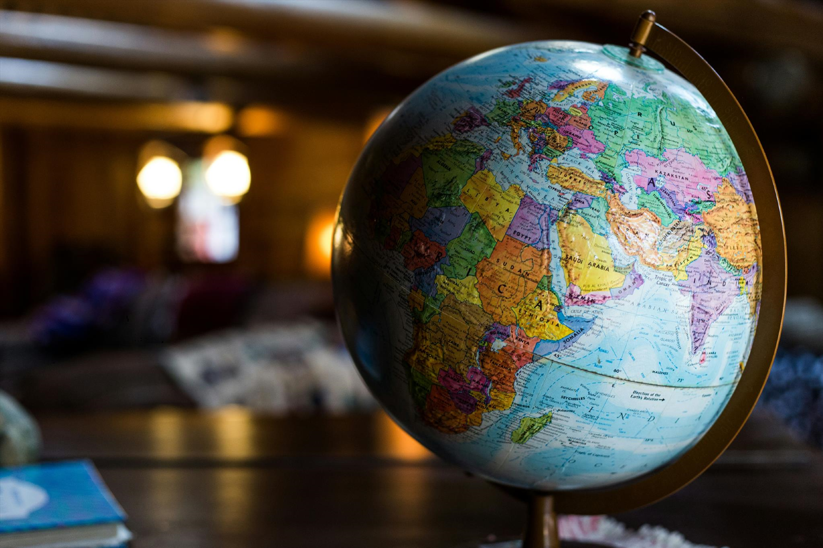 World globe on desk representing global communication and cross-cultural business interactions